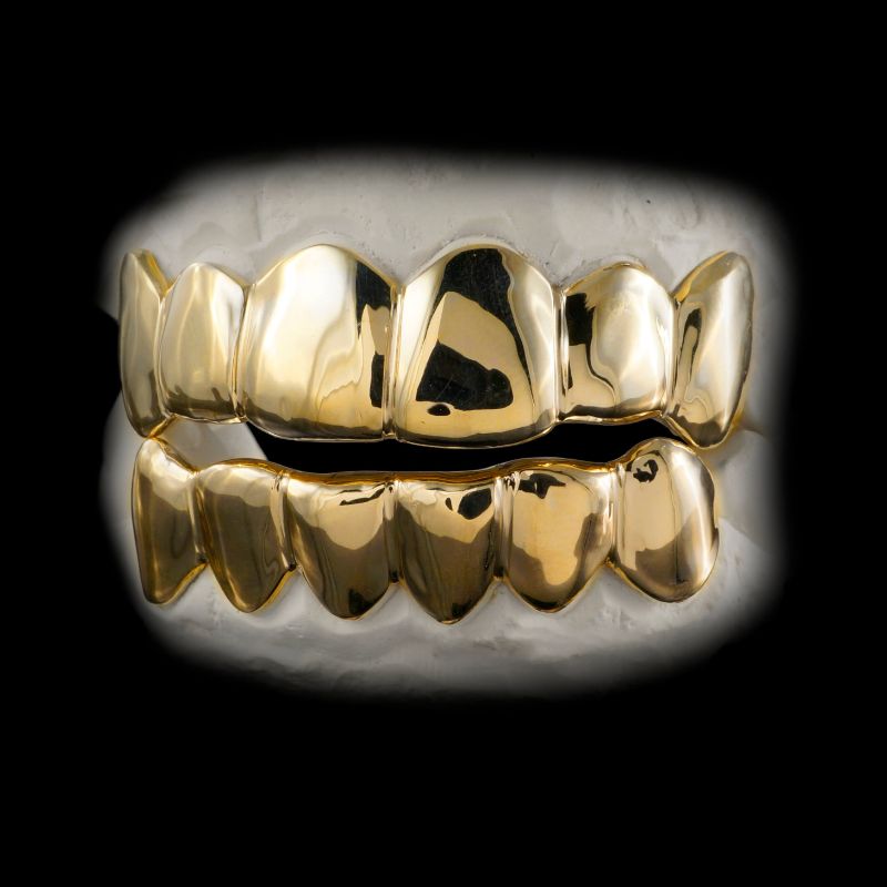 Liên hệ địa chỉ nha khoa uy tín để nhận bảng giá răng kim cương giả, răng vàng giả và răng giả titan