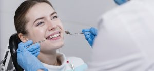 dentist performing dental check patient 23 2148396182 1